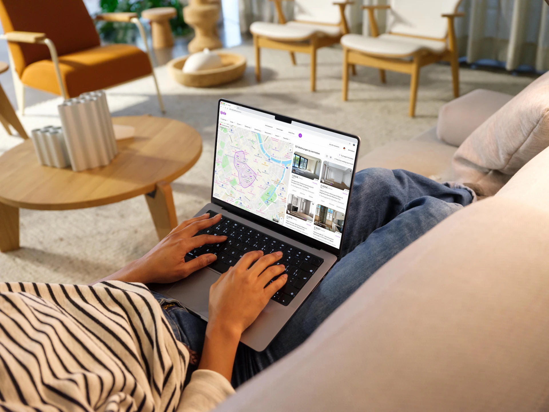 A Lystio team member working on a laptop at the office